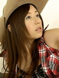 Adorable asian cowgirl tempts in her boots and jean shorts