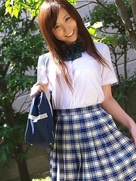 Schoolgirl Iyo Hanak poses at the open air in sexy skirt